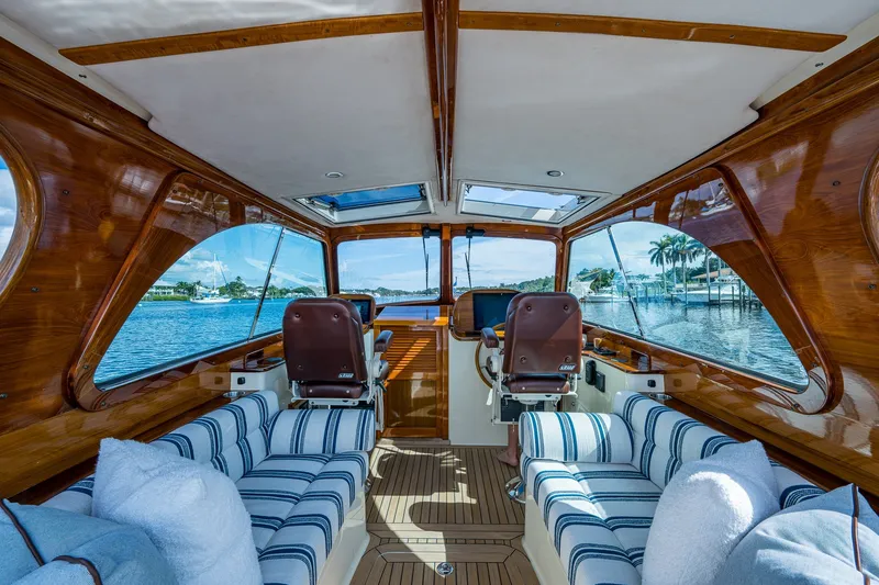 Slide: The Image of Interior of 2009 Hinckley Picnic Boat 37 MKIII with luxurious seating and scenic water view. - 15