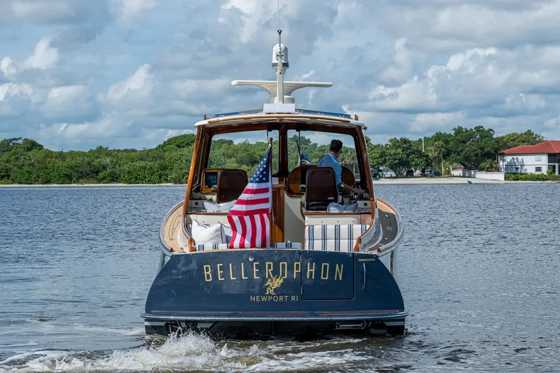Slide: The Image of Hinckley Picnic Boat 37 MKIII, 2009, cruising on water with American flag. - 3