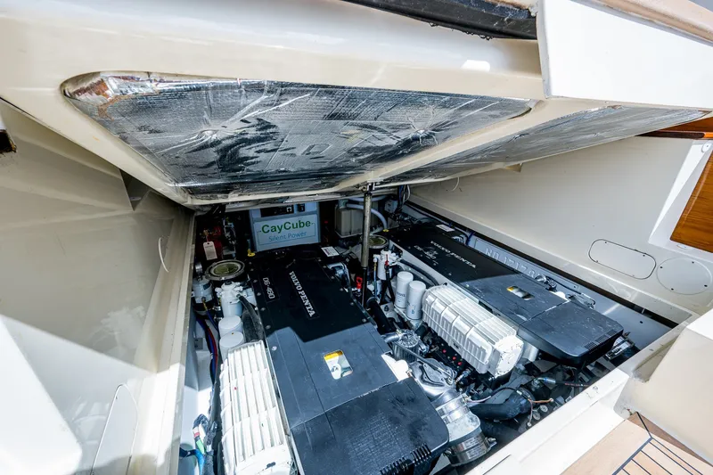 Slide: The Image of Engine compartment of a 2009 Hinckley Picnic Boat 37 MKIII, showcasing dual Volvo Penta engines. - 27