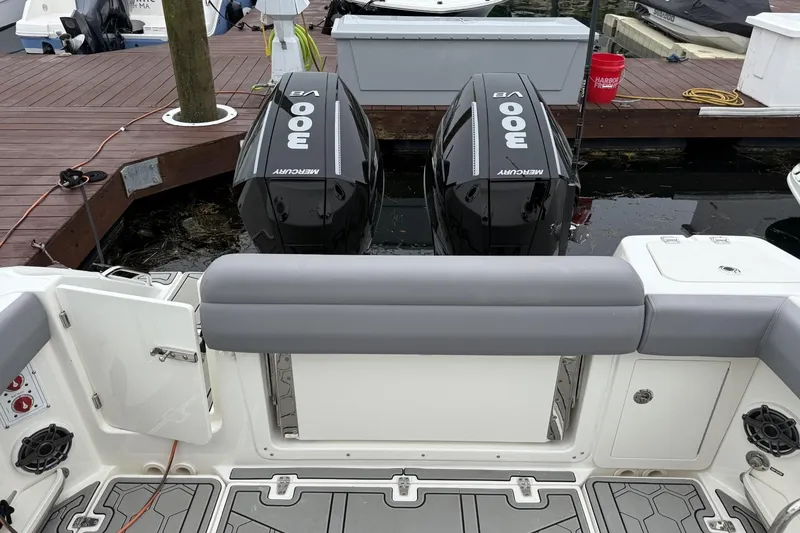 Slide: The Image of 2024 Boston Whaler 280 Outrage with twin Mercury 300 engines at dock. - 9