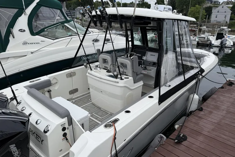 Slide: The Image of 2024 Boston Whaler 280 Outrage docked, showcasing sleek design and modern features. - 4