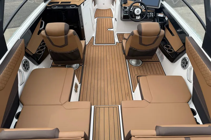 Slide: The Image of Luxurious interior of 2024 Yamaha Boats 222SD with brown seating and sleek design. - 13