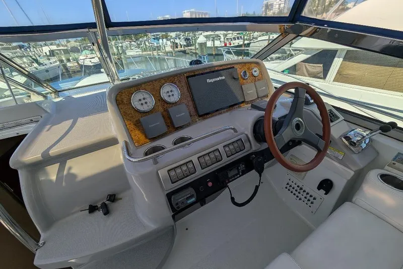 Slide: The Image of Helm of 2008 Formula 40 Performance Cruiser with steering wheel and navigation instruments. - 14