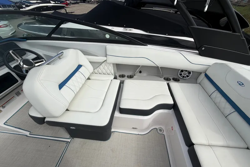 Slide: The Image of Luxurious interior of 2021 Regal LS2 Surf boat with white seating and modern design. - 6