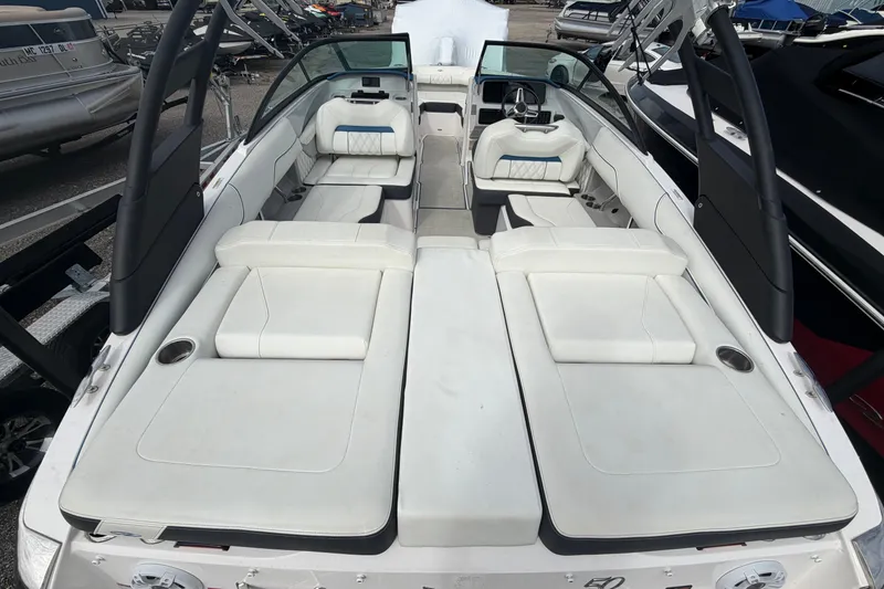 Slide: The Image of 2021 Regal LS2 Surf boat interior with white seating and modern design. - 2