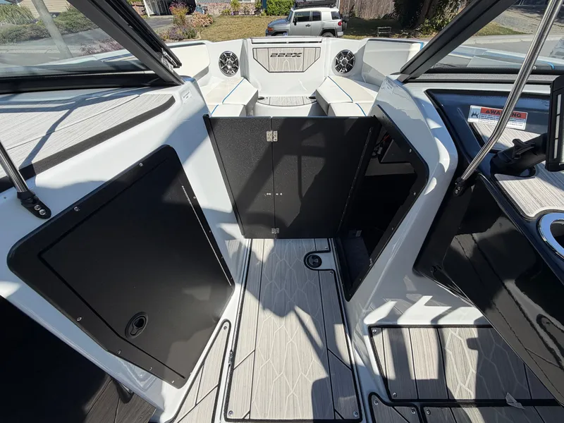 Slide: The Image of The image shows the cockpit of a 2023 Yamaha 222XE boat with modern controls. - 17