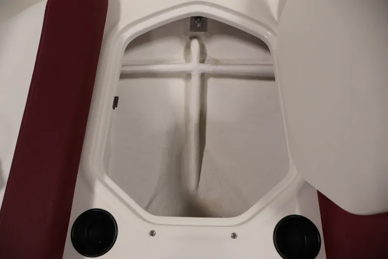 Slide: The Image of Open storage compartment in 2015 Bayliner Element 180 XL boat interior. - 16