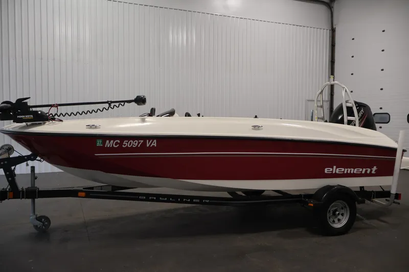 Slide: The Image of 2015 Bayliner Element 180 XL boat on trailer in indoor storage. - 8