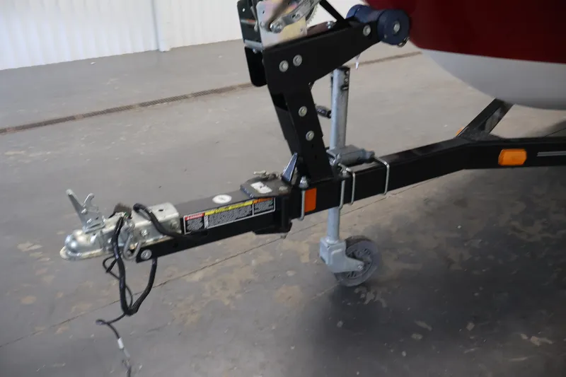 Slide: The Image of Trailer hitch of 2015 Bayliner Element 180 XL boat in a garage setting. - 45