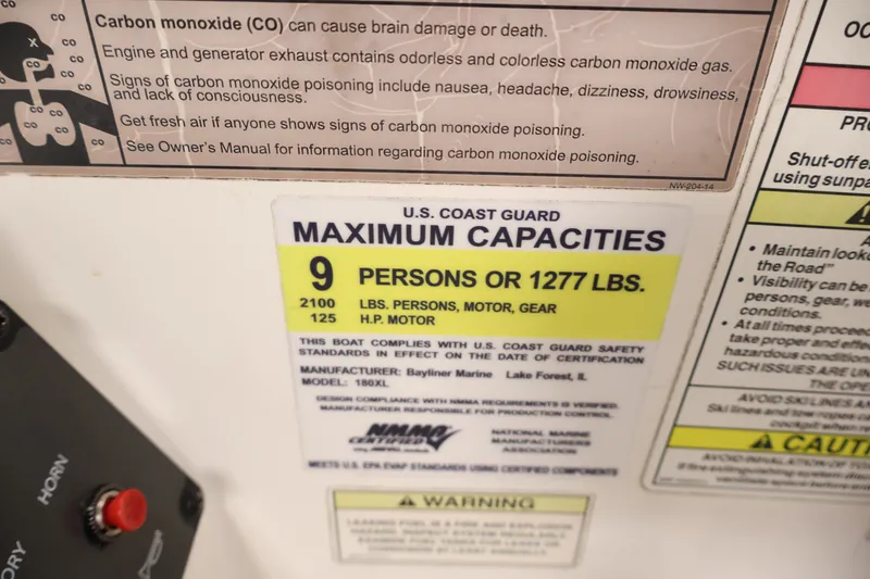 Slide: The Image of 2015 Bayliner Element 180 XL capacity label: 9 persons or 1277 lbs, U.S. Coast Guard compliant. - 29