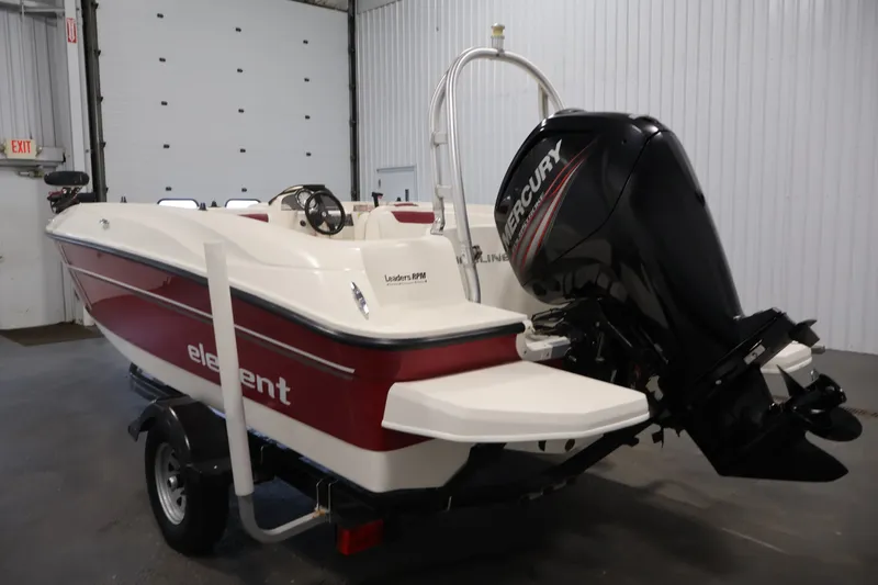 Slide: The Image of 2015 Bayliner Element 180 XL boat with Mercury engine in a garage setting. - 7