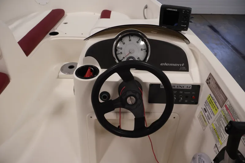 Slide: The Image of 2015 Bayliner Element 180 XL boat dashboard with steering wheel and gauges. - 22