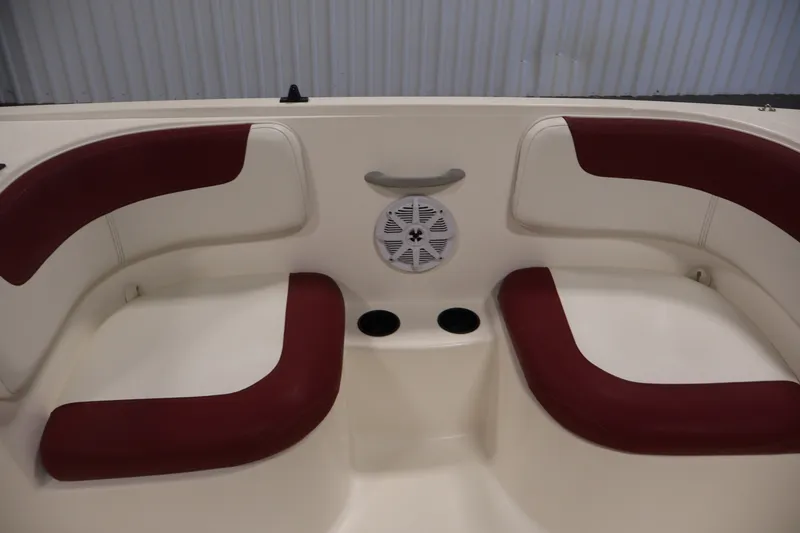 Slide: The Image of 2015 Bayliner Element 180 XL boat interior with red cushioned seating and speaker. - 32