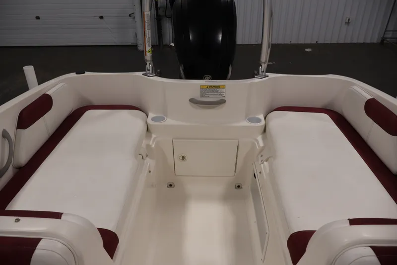 Slide: The Image of 2015 Bayliner Element 180 XL boat interior with red and white seating. - 36