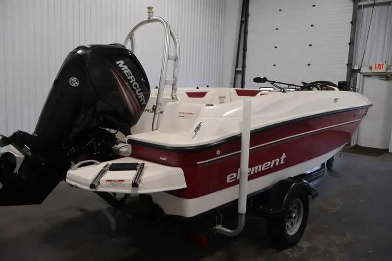 Slide: The Image of 2015 Bayliner Element 180 XL boat with Mercury engine in a garage setting. - 5