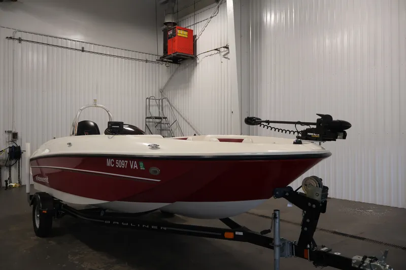 Slide: The Image of 2015 Bayliner Element 180 XL boat in indoor storage, red and white exterior. - 3