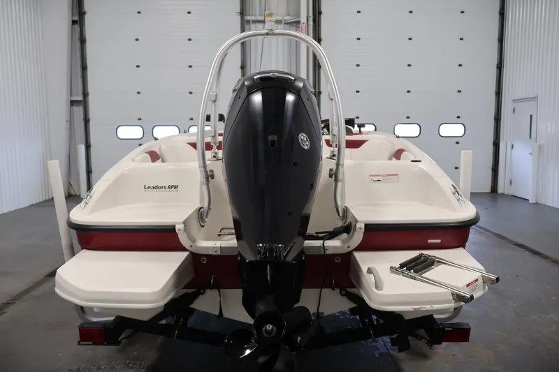 Slide: The Image of 2015 Bayliner Element 180 XL boat in a garage, rear view with outboard motor. - 6