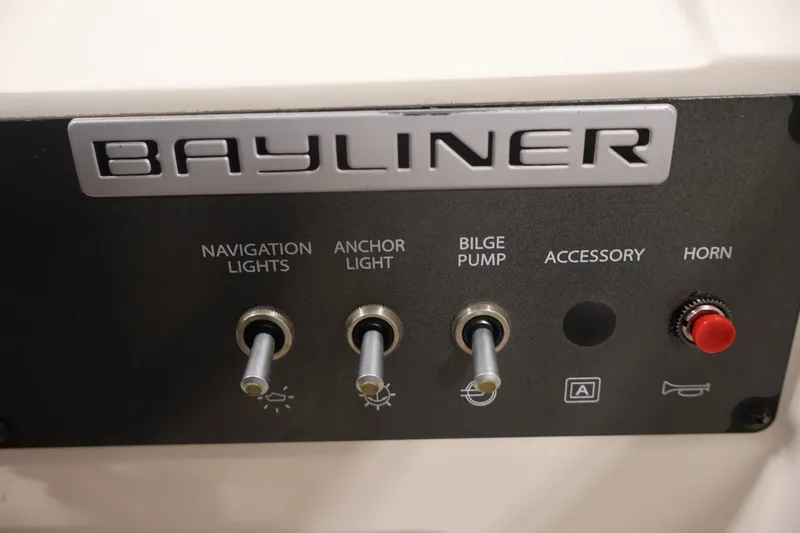 Slide: The Image of Control panel of 2015 Bayliner Element 180 XL with switches for lights, bilge pump, and horn. - 28