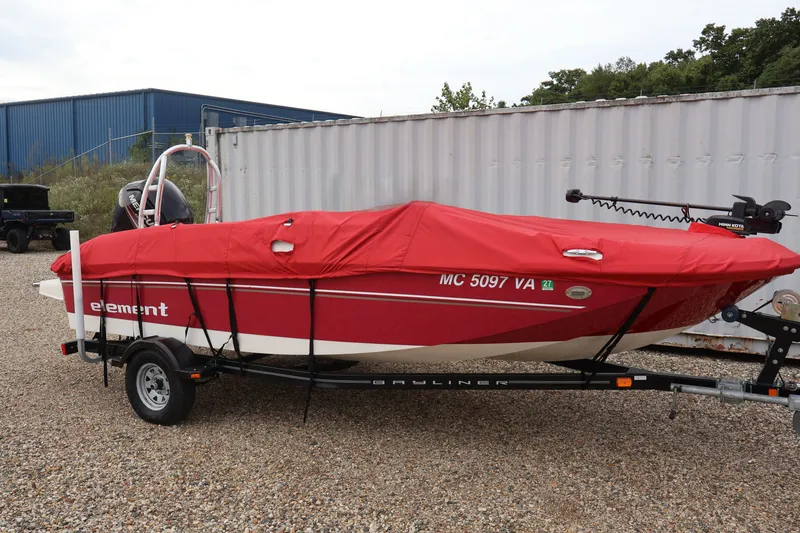 Slide: The Image of 2015 Bayliner Element 180 XL boat with red cover on trailer. - 51