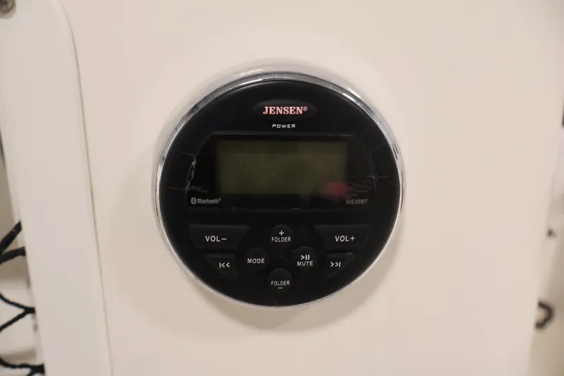 Slide: The Image of Jensen audio system on 2015 Bayliner Element 180 XL boat dashboard. - 27