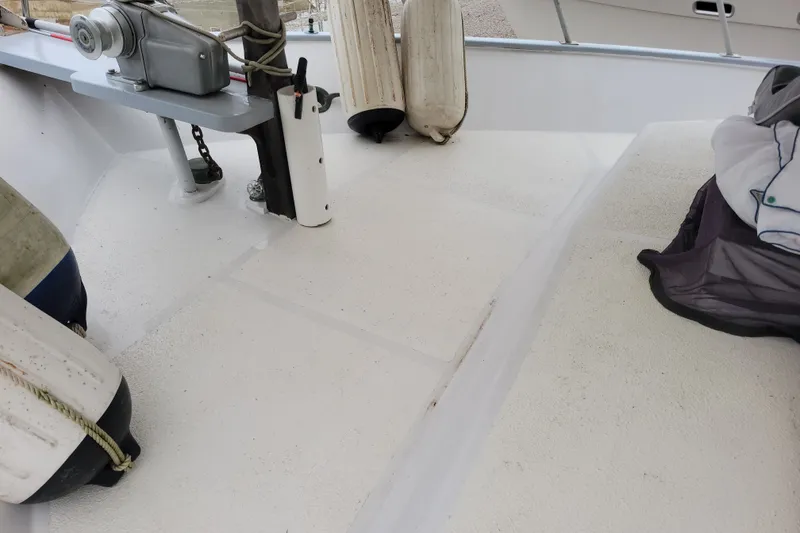 Slide: The Image of 1980 DeFever 41 Trawler deck with winch and fenders. - 18