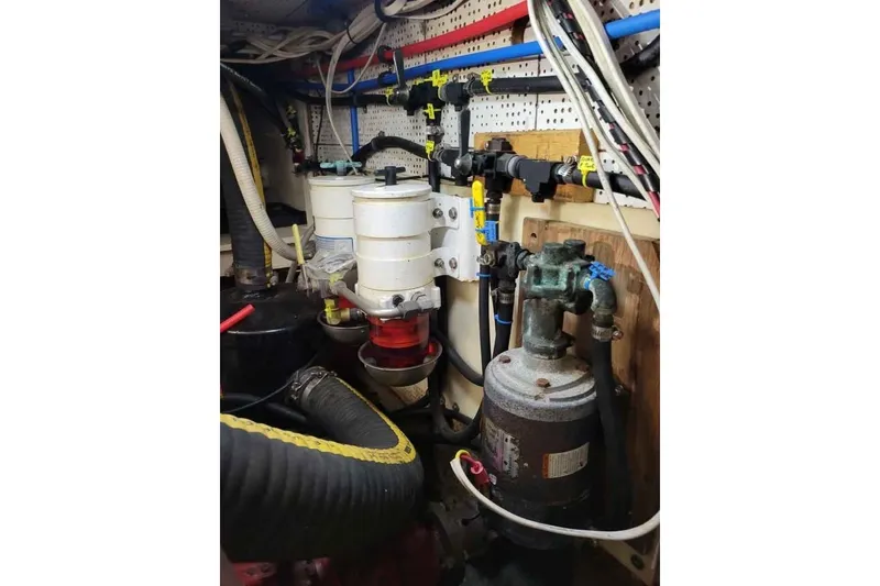 Slide: The Image of Engine room of 1980 DeFever 41 Trawler with mechanical components and wiring. - 7