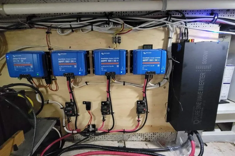 Slide: The Image of Electrical setup on a 1980 DeFever 41 Trawler with charge controllers and inverter. - 10