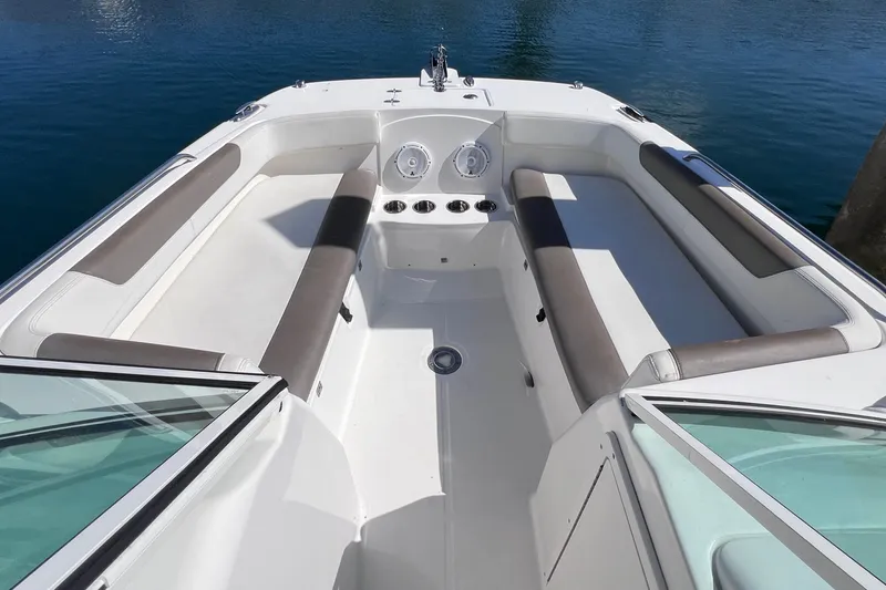 Slide: The Image of 2021 World Cat 230 DC boat interior with spacious seating and cup holders. - 17