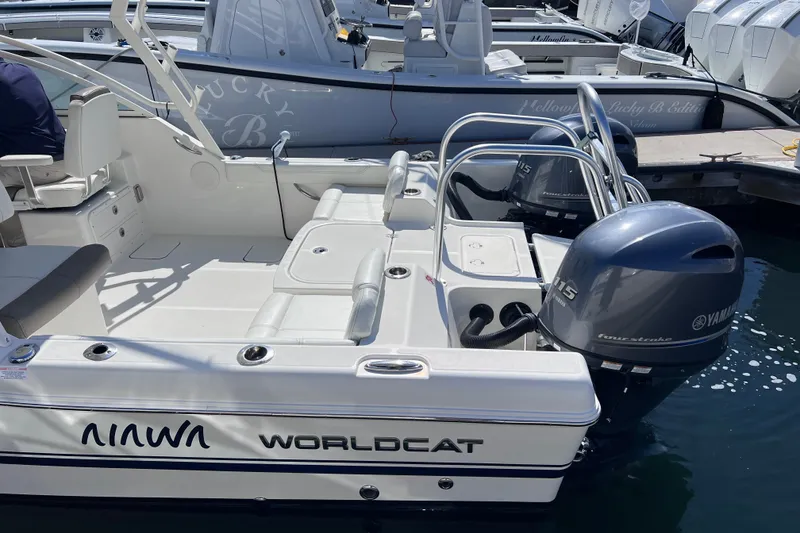 Slide: The Image of 2021 World Cat 230 DC boat with Yamaha outboard engines docked at marina. - 11