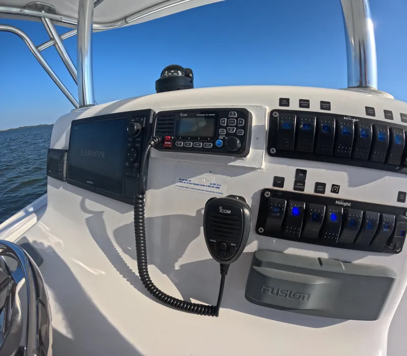 Slide: The Image of The cockpit of a 2018 Foster 26 boat with navigation and communication equipment. - 14