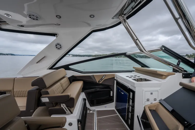Slide: The Image of Interior of 2025 Monterey 385SS Super Sport boat with luxurious seating and modern amenities. - 35