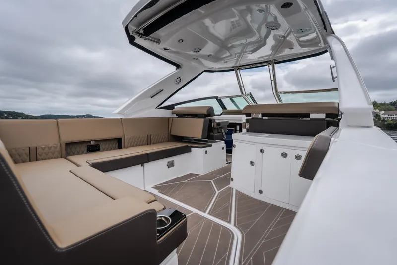 Slide: The Image of 2025 Monterey 385SS Super Sport boat interior with luxurious seating and modern design. - 11