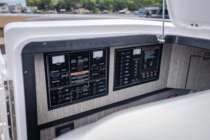 Slide: The Image of Control panel of 2025 Monterey 385SS Super Sport boat, featuring various switches and gauges. - 31