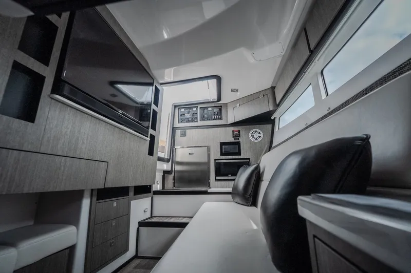 Slide: The Image of Interior of 2025 Monterey 385SS Super Sport boat, featuring modern amenities and sleek design. - 27
