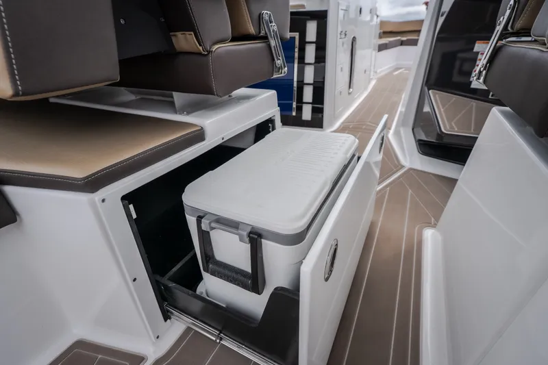 Slide: The Image of 2025 Monterey 385SS Super Sport boat interior with built-in cooler storage. - 14