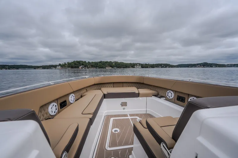 Slide: The Image of Luxurious seating on 2025 Monterey 385SS Super Sport boat, with scenic lake view. - 39