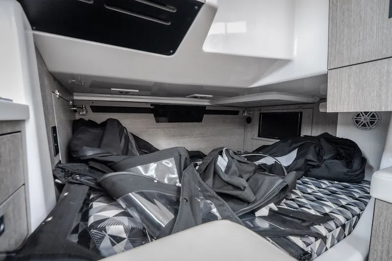 Slide: The Image of Interior cabin of 2025 Monterey 385SS Super Sport boat with storage and bedding. - 29