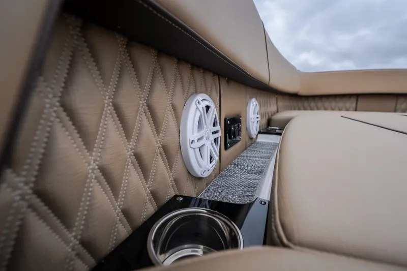 Slide: The Image of Luxurious interior of 2025 Monterey 385SS Super Sport boat with speakers and cup holder. - 48
