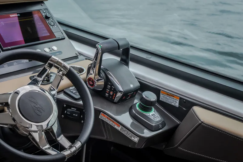 Slide: The Image of Cockpit of 2025 Monterey 385SS Super Sport boat with advanced controls and steering wheel. - 22