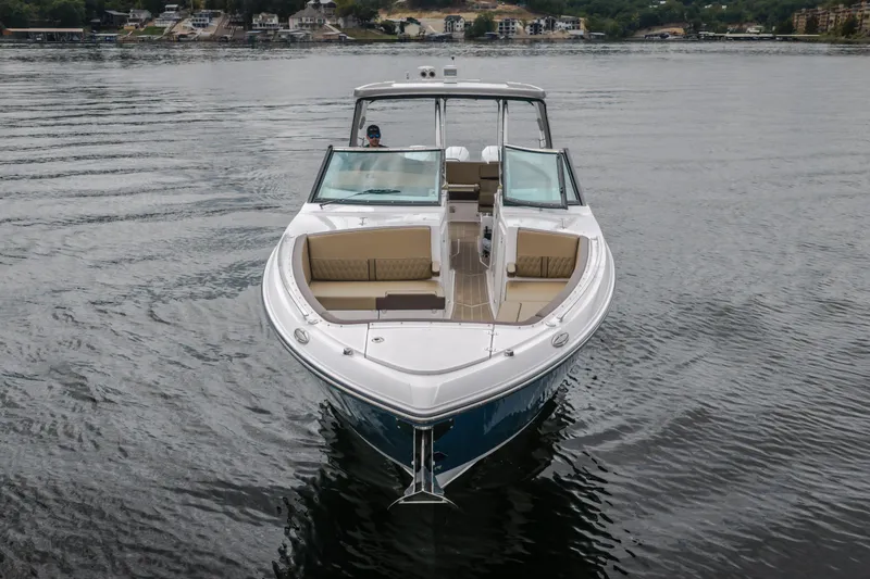 Slide: The Image of 2025 Monterey 385SS Super Sport boat on calm water, front view. - 46
