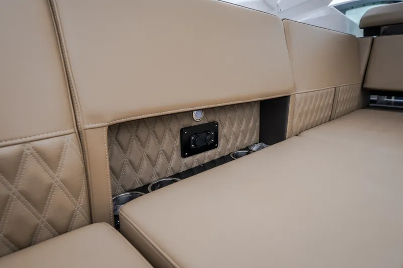 Slide: The Image of Luxurious tan seating with diamond stitching in 2025 Monterey 385SS Super Sport boat. - 57