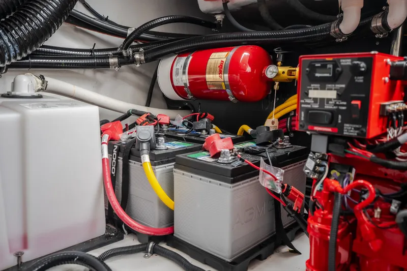 Slide: The Image of Engine compartment of 2025 Monterey 385SS Super Sport with batteries and fire extinguisher. - 62
