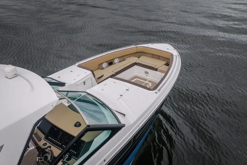 Slide: The Image of 2025 Monterey 385SS Super Sport boat on water, featuring spacious seating and modern design. - 45