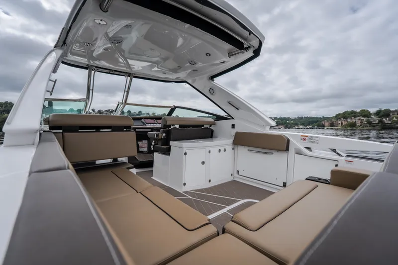 Slide: The Image of 2025 Monterey 385SS Super Sport boat interior with luxurious seating and modern design. - 10