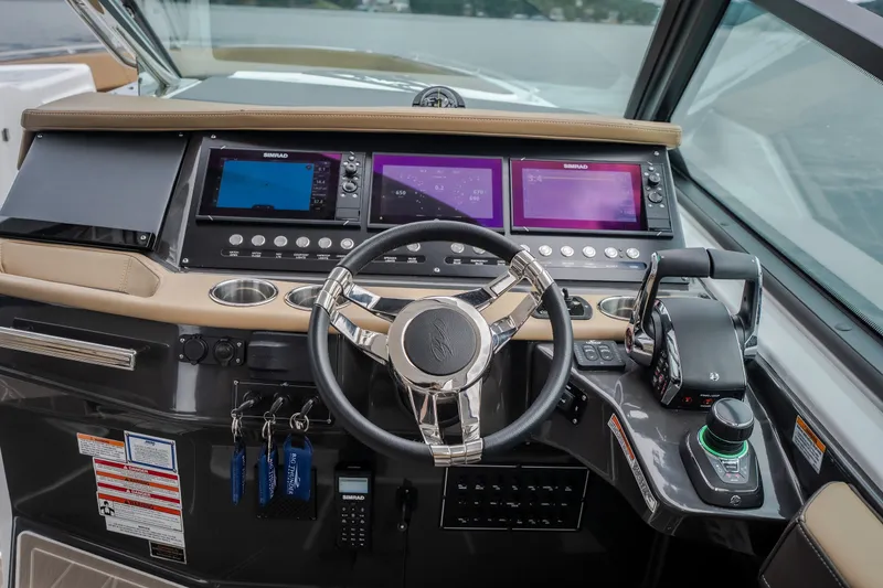 Slide: The Image of 2025 Monterey 385SS Super Sport helm with advanced navigation displays and controls. - 21
