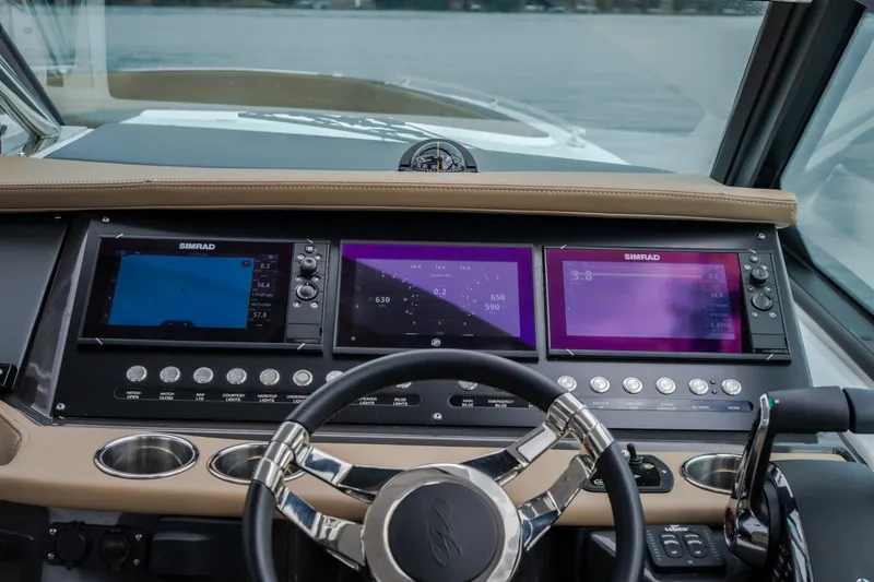 Slide: The Image of 2025 Monterey 385SS Super Sport dashboard with advanced navigation displays and controls. - 23