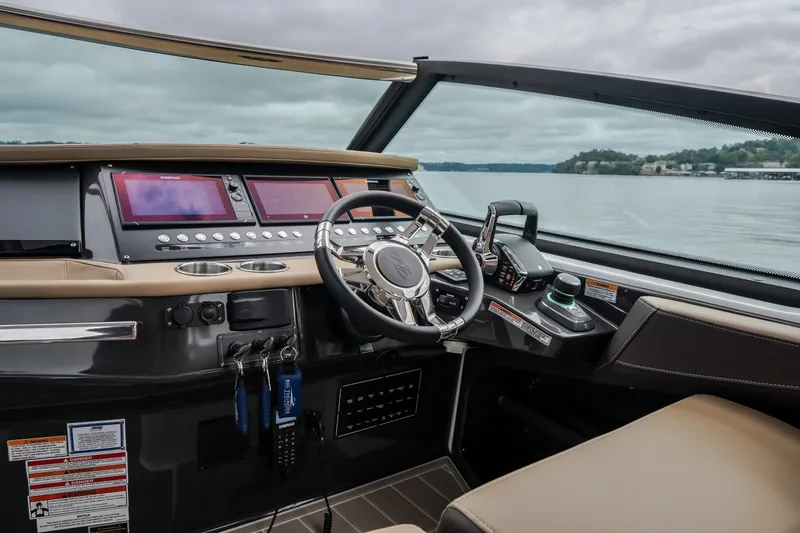 Slide: The Image of Cockpit of 2025 Monterey 385SS Super Sport boat with advanced controls and displays. - 17
