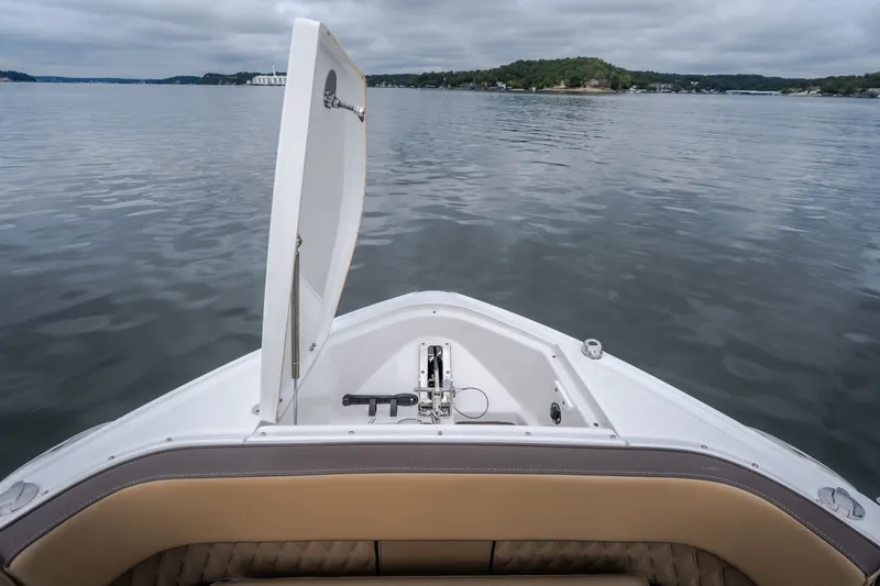 Slide: The Image of 2025 Monterey 385SS Super Sport boat on calm lake with open hatch. - 43