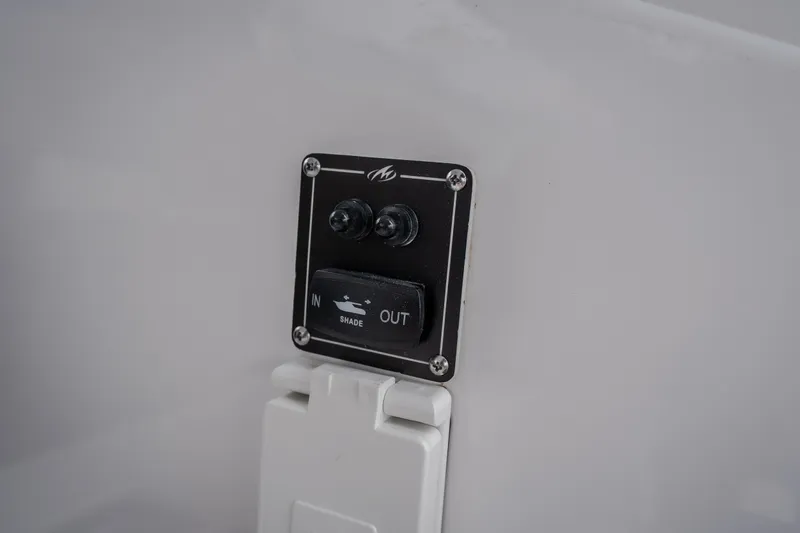Slide: The Image of Control panel on 2025 Monterey 385SS Super Sport boat, featuring shade adjustment switch. - 54