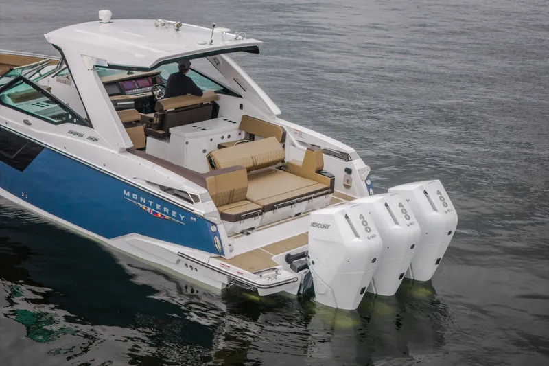 Slide: The Image of 2025 Monterey 385SS Super Sport boat with triple Mercury engines on water. - 3
